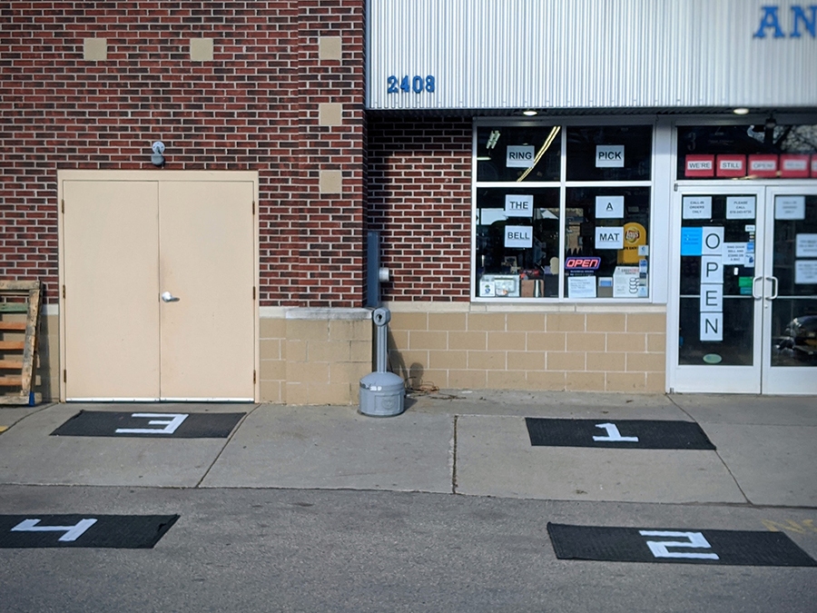 At Alger Hardware in Grand Rapids, Mich., customers ring the bell and then wait on a numbered mat to get products delivered to them curbside.