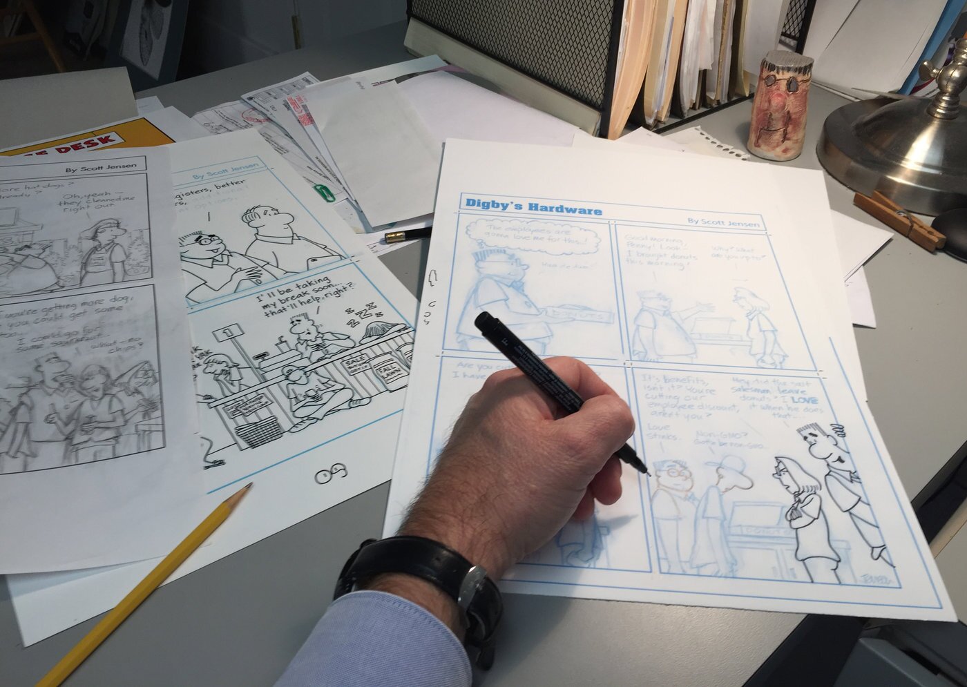Each strip is drawn first in pencil, where all the details are refined.