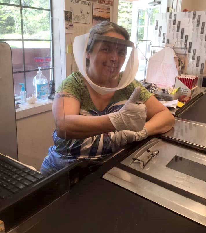 ToshCo employees wear face shields to stay safe.