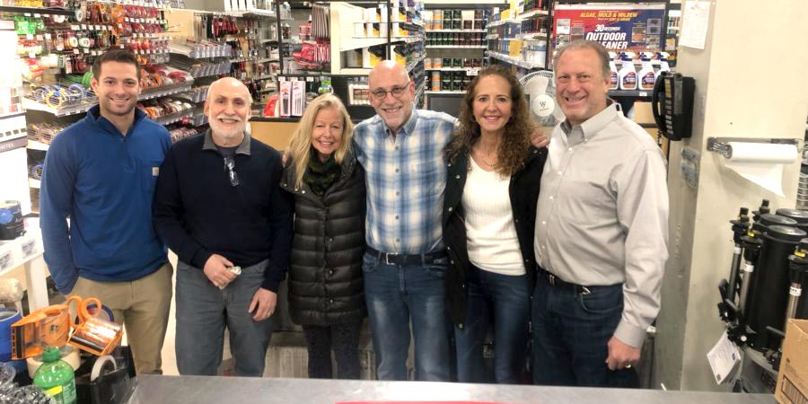 Owners of the two companies gathered in January after Rocky’s Ace bought Karp’s Hardware. From l to r: Johnny Falcone, David Fogel, Megan Fogel and husband Marc Fogel, Donna Falcone and Rocco Falcone.
