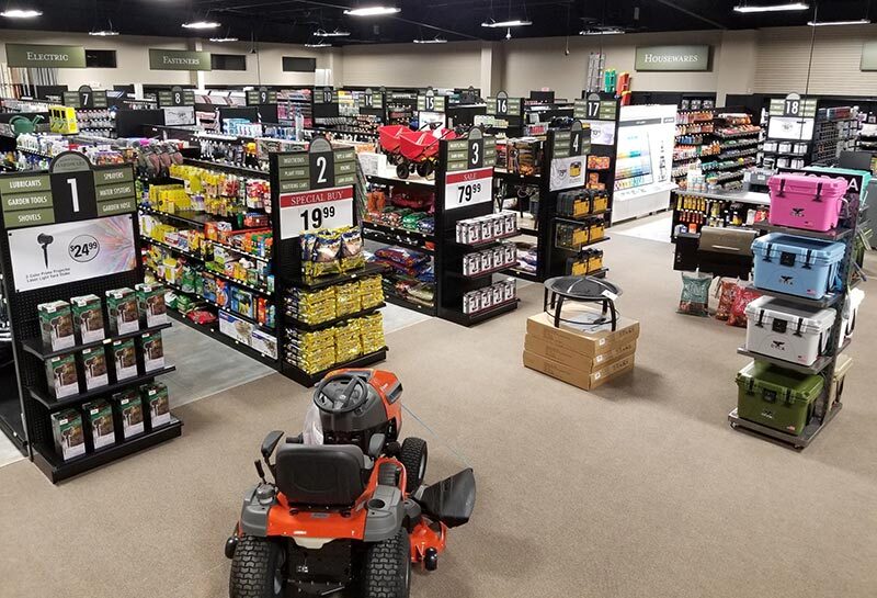 A carpeted area in the first 1,500 square feet creates a decompression zone that deadens sound while encouraging people to chat with neighbors. Black shelves were used to make products pop.