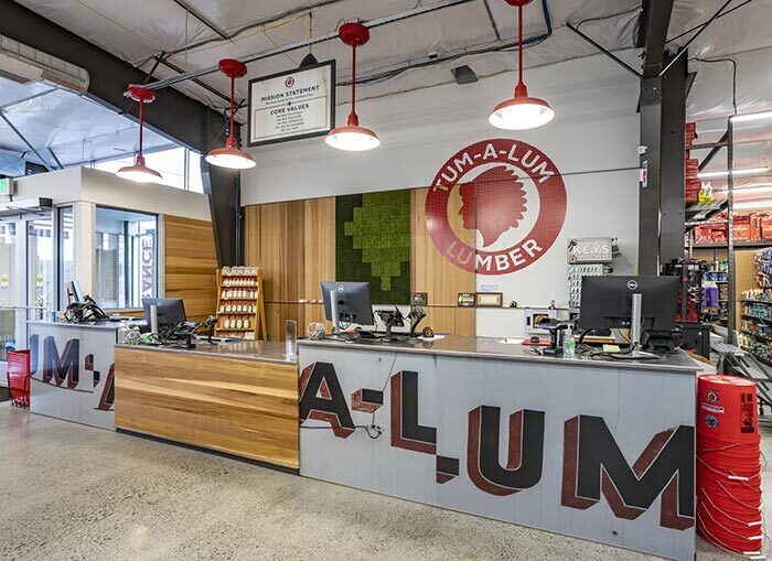 The service counter was moved to the front of the store, so each customer can be greeted with a smile. The base of the front counter recreates the previous location’s exterior signage.