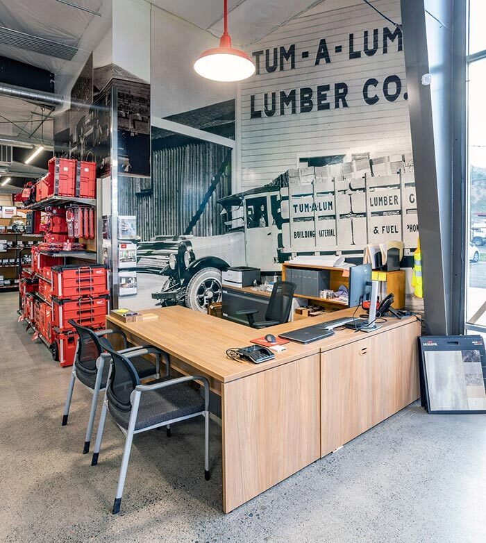 Connecting to the company’s long service to its community, the store displays many large historic photos, like the Tum-A-Lum delivery truck depicted behind this contractor sales desk.