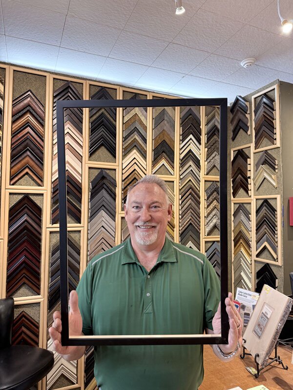 Larry Myers frames the idea at the center of his business: giving customers more reasons to walk through the door. At River Ridge Hardware, the combination of hardware and custom framing has created a steady draw built around service, craft and a strong connection to the community. 