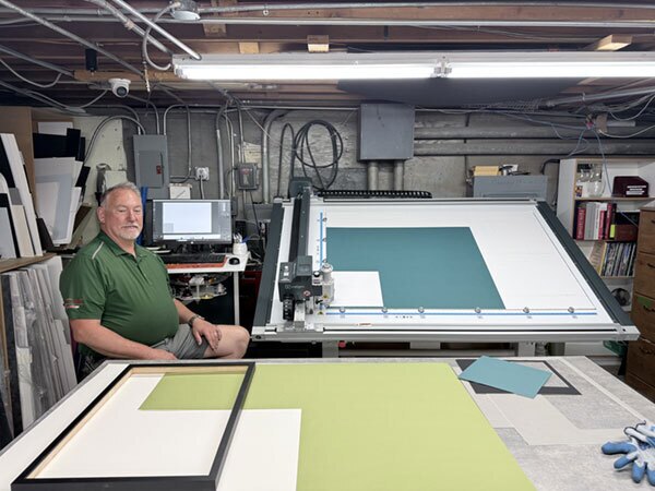 Behind the scenes, the framing operation at River Ridge Hardware runs as its own workspace. The shop occupies about 1,000 square feet in the basement of the store, with an additional 200-square-foot display space upstairs. 