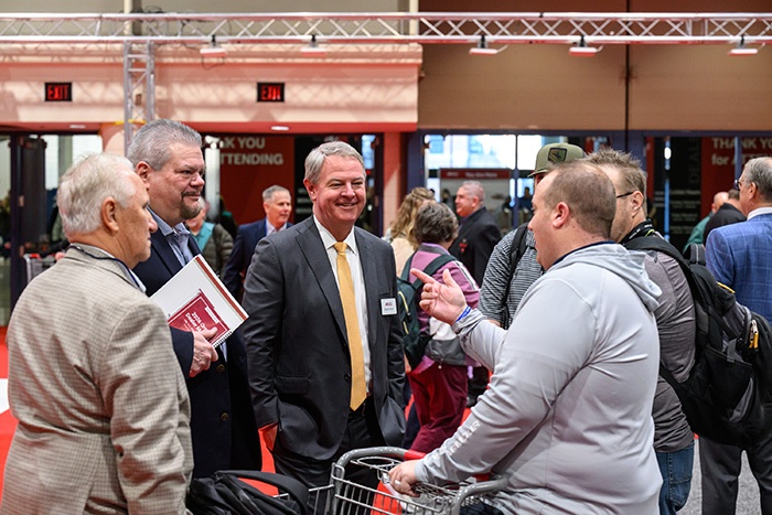 Moore with retailers 2 Busy Show Floor, New Vendors and Tech Trends Define Orgill 2025 Spring Market 
