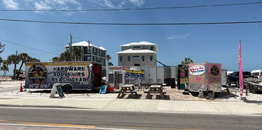 Operating from trailers, The Goodz continues to serve Fort Myers Beach with hardware, gifts, and ice cream while rebuilding a stronger, elevated store just steps away.