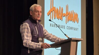 Henry at podium House-Hasson Dealer Market Maintains Momentum as Storm Alters Plans
