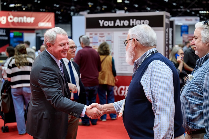 Inside Orgill’s 2026 Dealer Market: Buying, Strategy and Store Concepts 4 Moore handshake1 Inside Orgill’s 2026 Dealer Market: Buying, Strategy and Store Concepts
